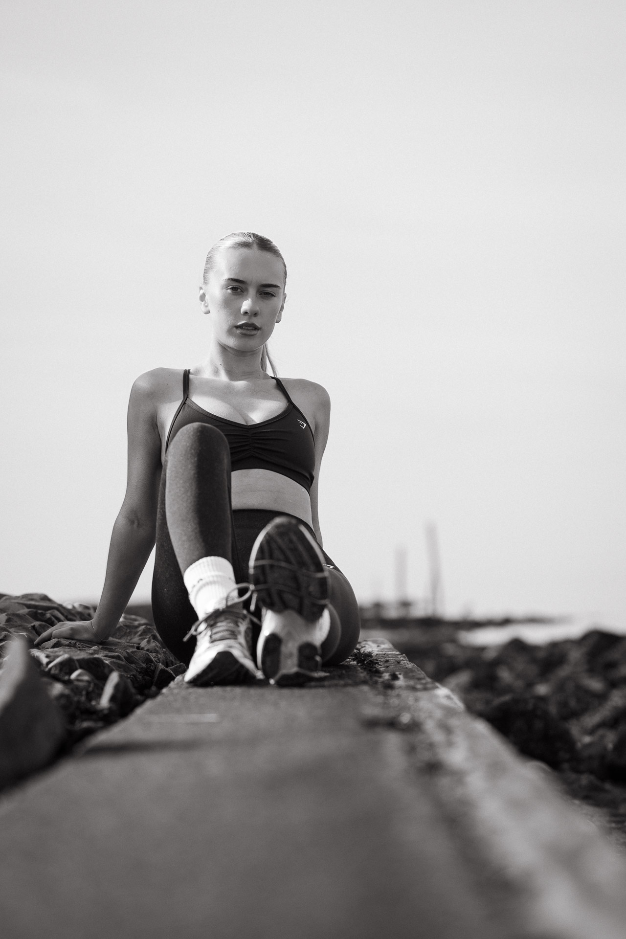Outdoor fitness portrait at Irvine Harbour in Ayrshire, capturing natural strength and focus in a documentary photography style.
