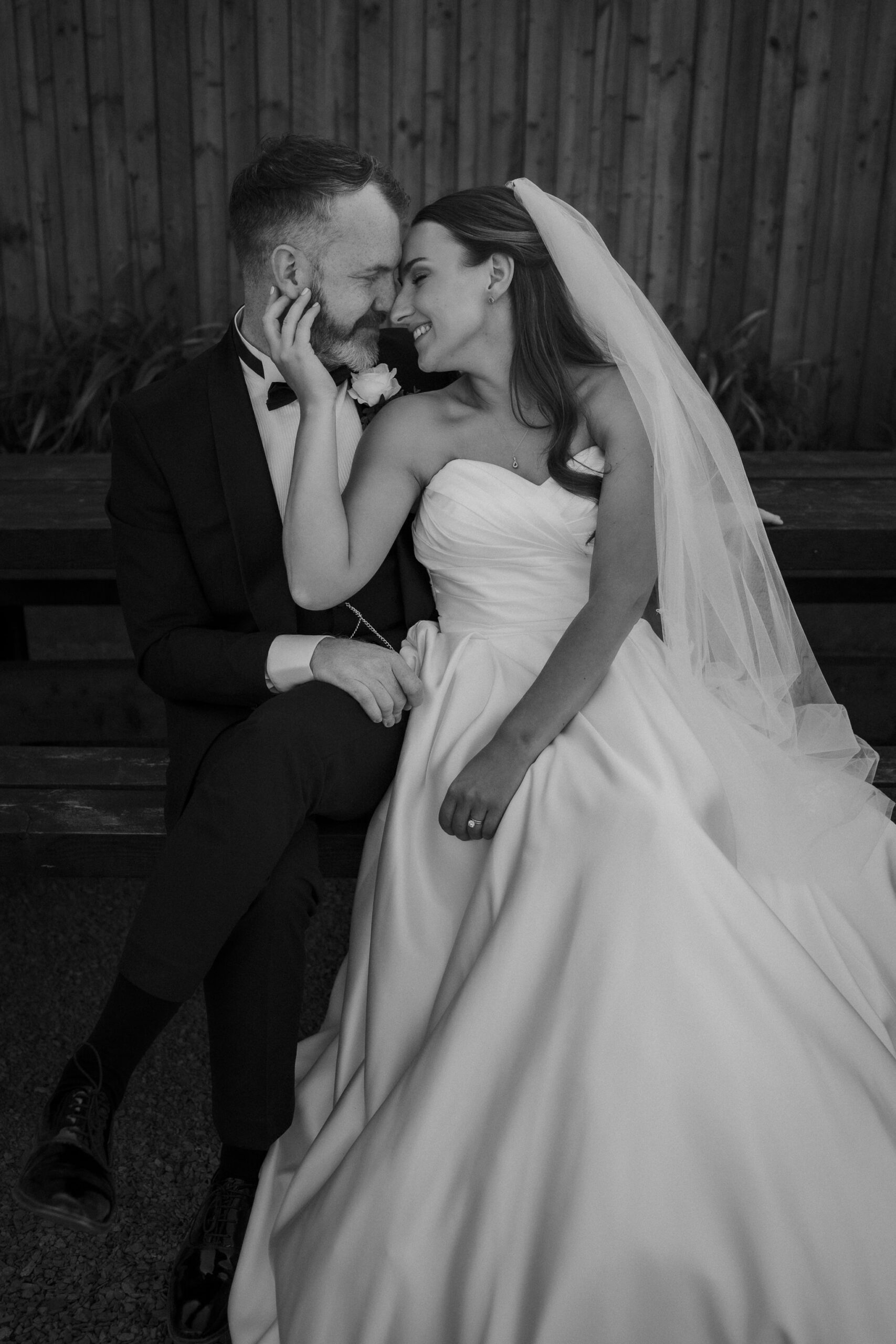 Bride and groom smiling together during relaxed wedding portraits in Scotland