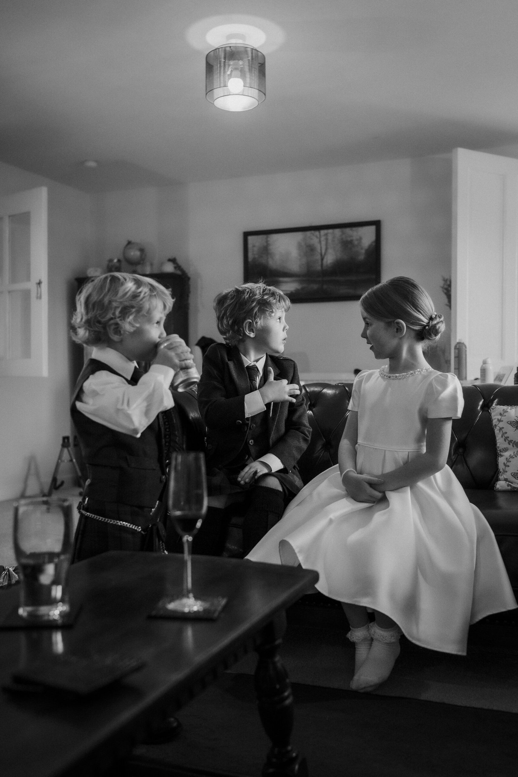 Children dressed for a wedding during bridal preparations in Ayrshire.