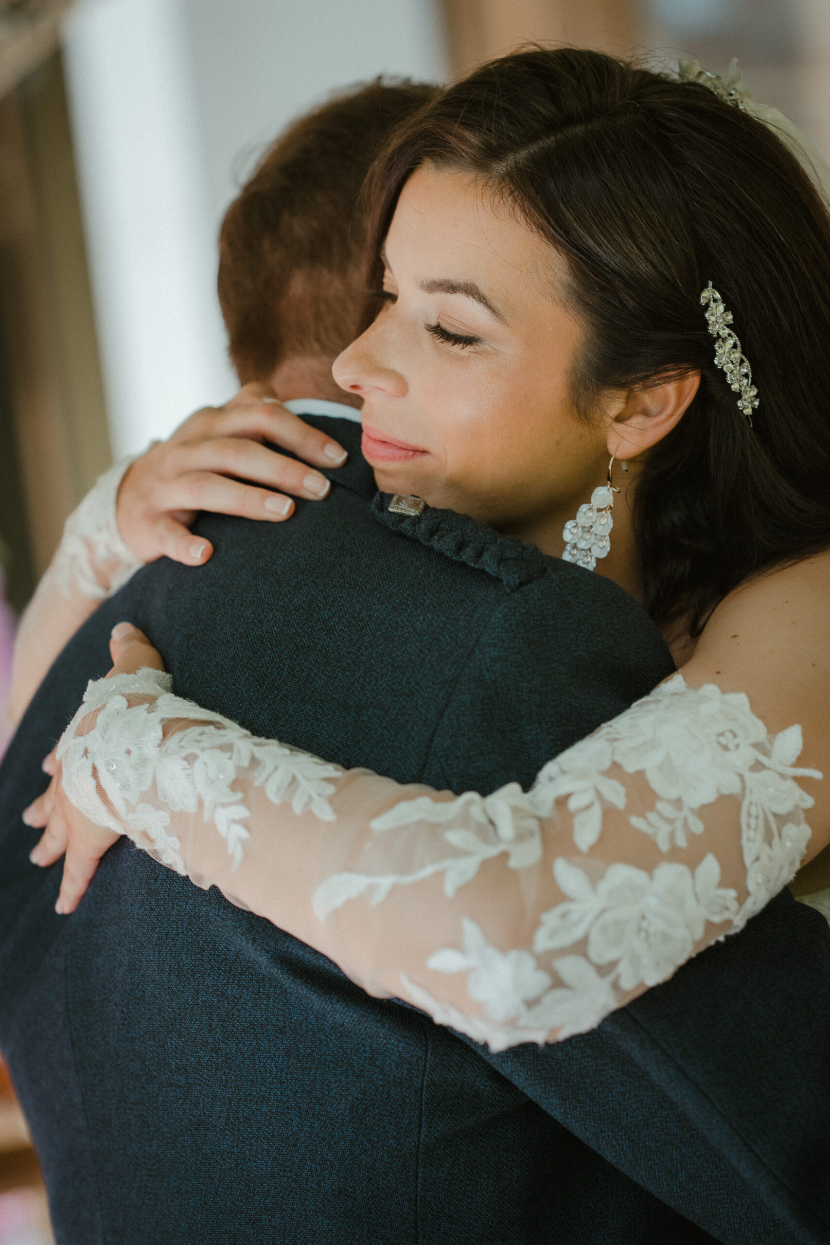 Bride embracing her groom before their Glasgow wedding ceremony.
