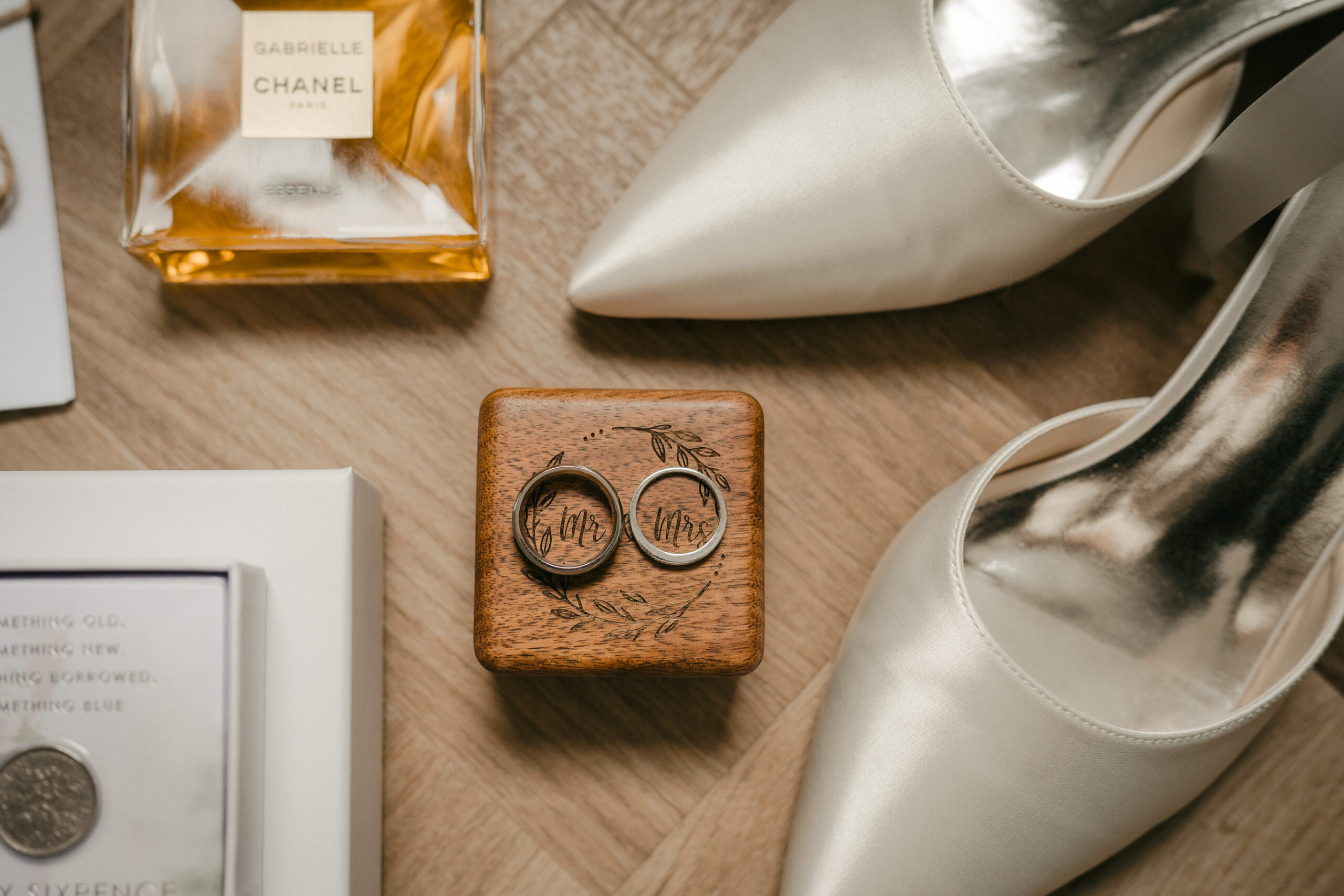 Bride’s shoes, wedding rings and perfume on the morning of the wedding in Fenwick